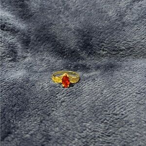 Elegant Gold Ring with Red Gemstone 14k